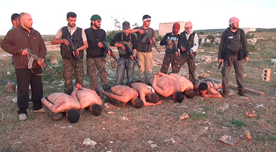 Figure 1: Still from a video taken in Syria in 2012 and printed in a New York Times article. Haisam Omar Sakhanh, subsequently convicted in a Swedish court for war crimes, appears at the far left.